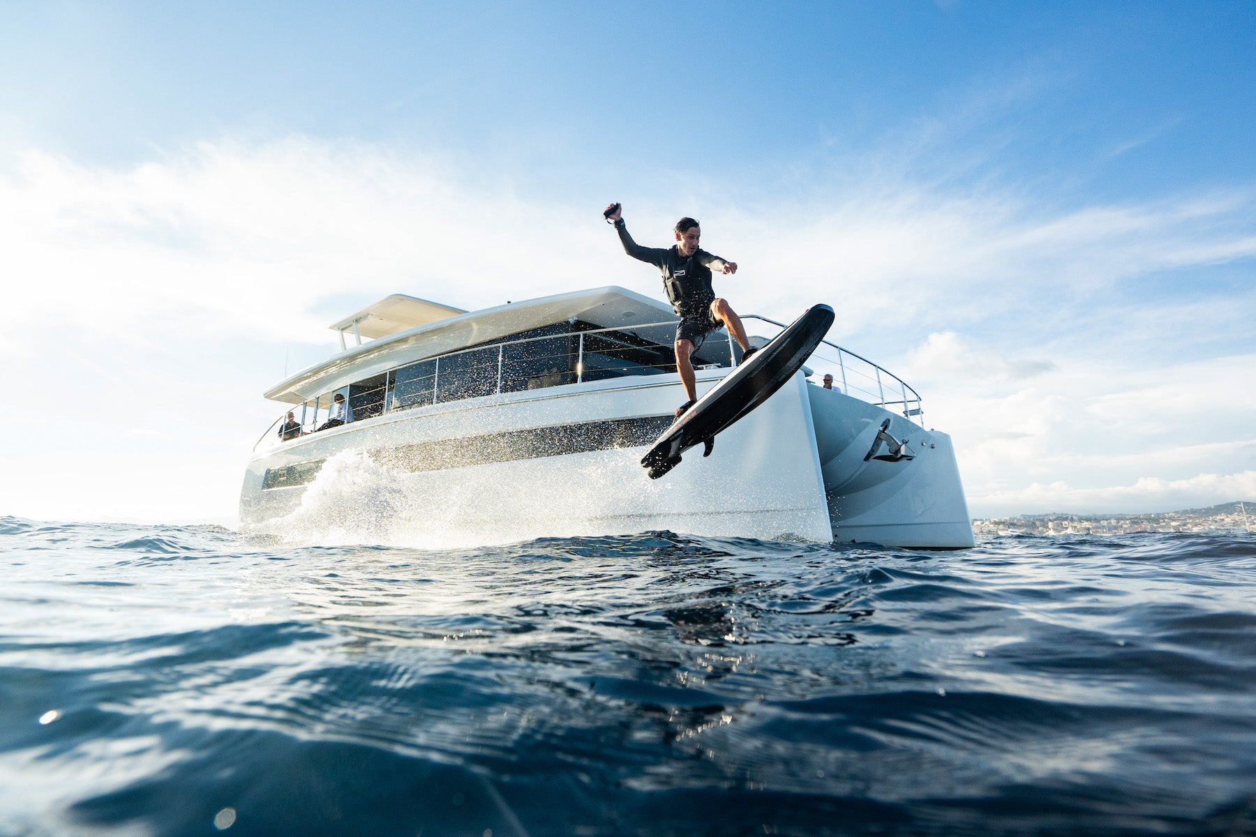 Awake Electric Surfboards RAVIK S jumping next to Silent Yachts in Cannes France